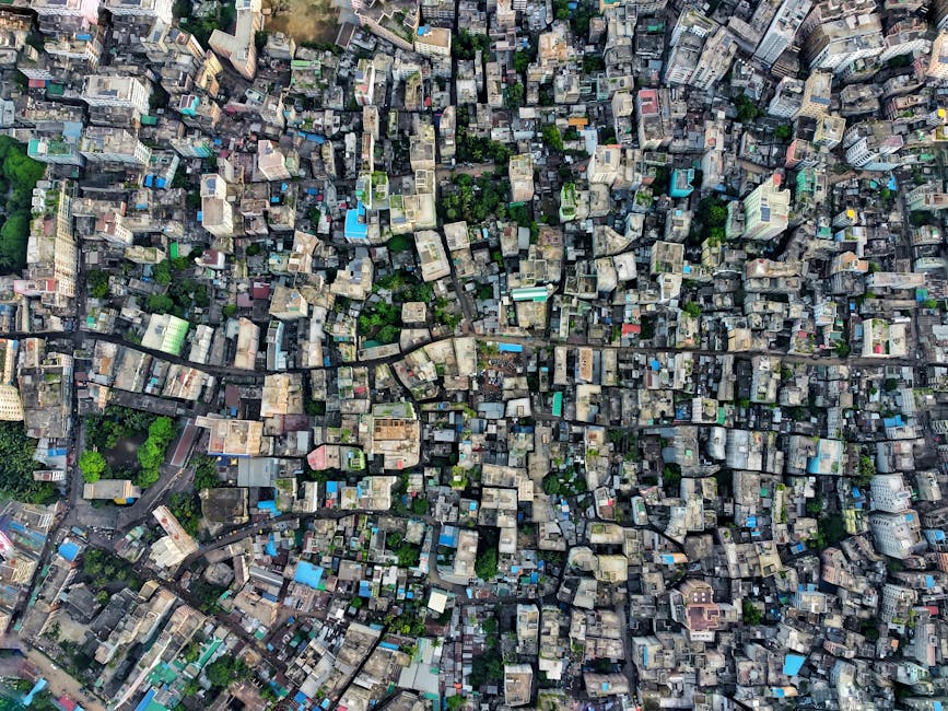 Aerial shot of a densely packed urban cityscape highlighting architecture and city planning.